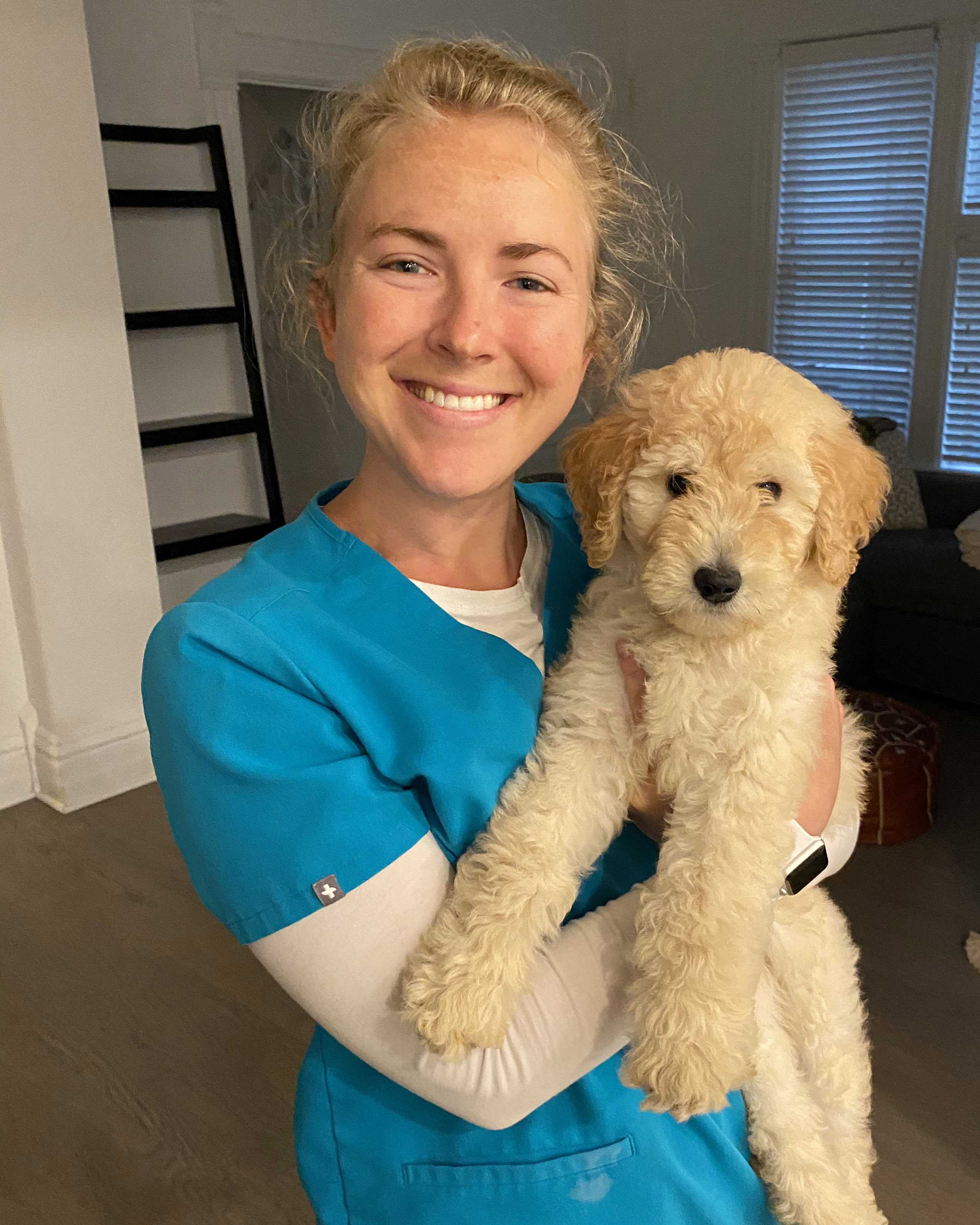 Caroline Delaney Nette holding her dog.